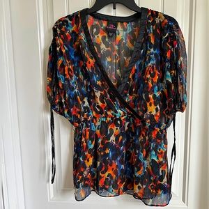 Sheer cheetah print blouse, ties at the arms
